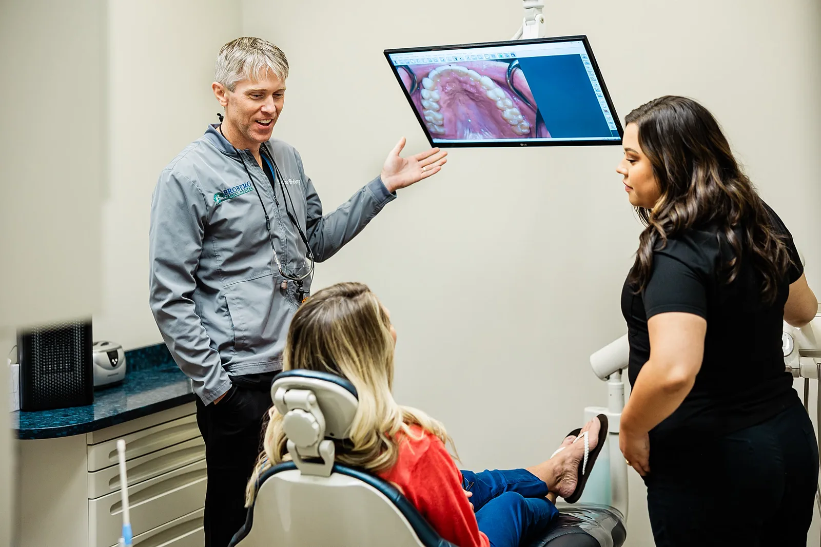Dr. Broberg consulting with a patient in the treatment room
